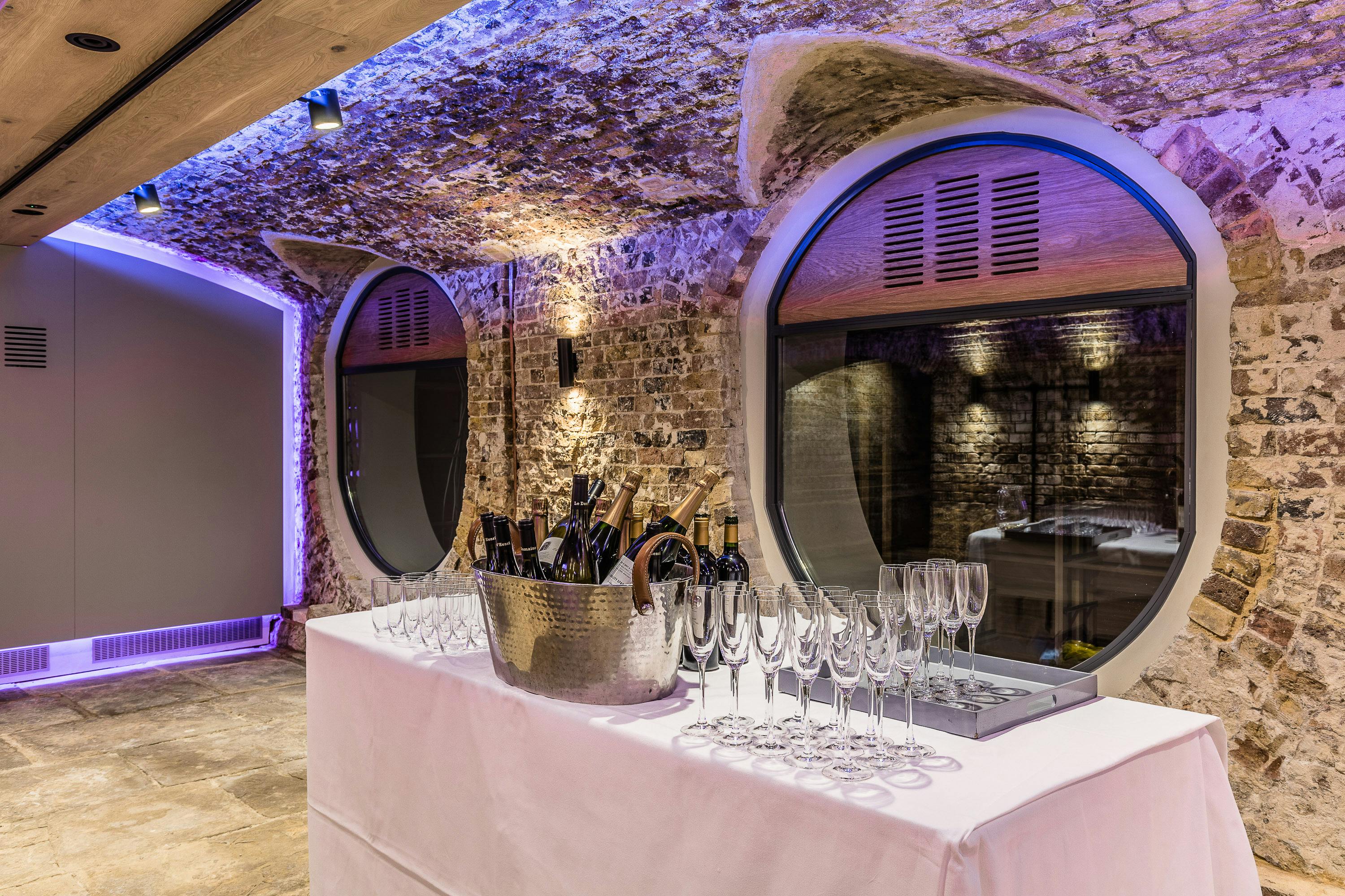 London Bridge Arches in Glaziers Hall, elegant event space with exposed stone walls.