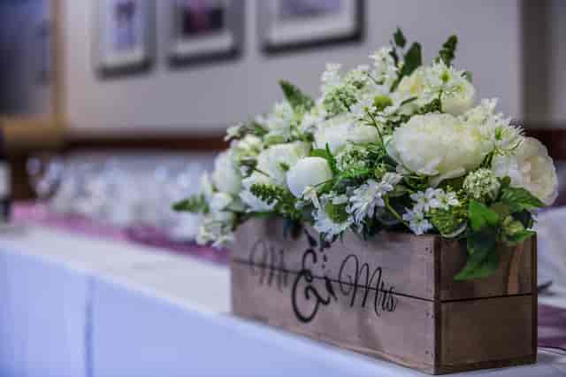 Floral centerpiece in rustic box for weddings at Phoenix Lounge, DW Stadium.