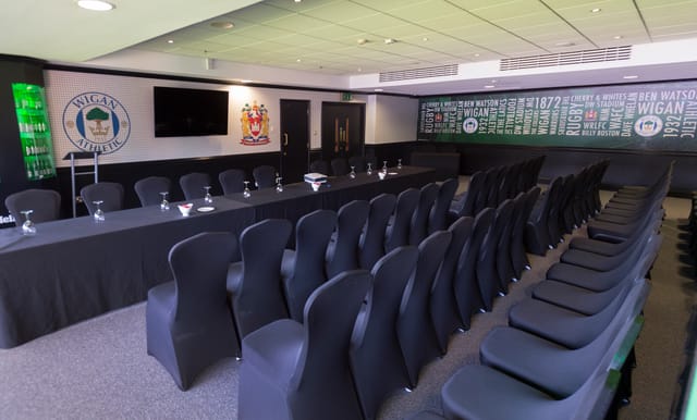 Carling Lounge meeting room at DW Stadium, modern decor for corporate events.