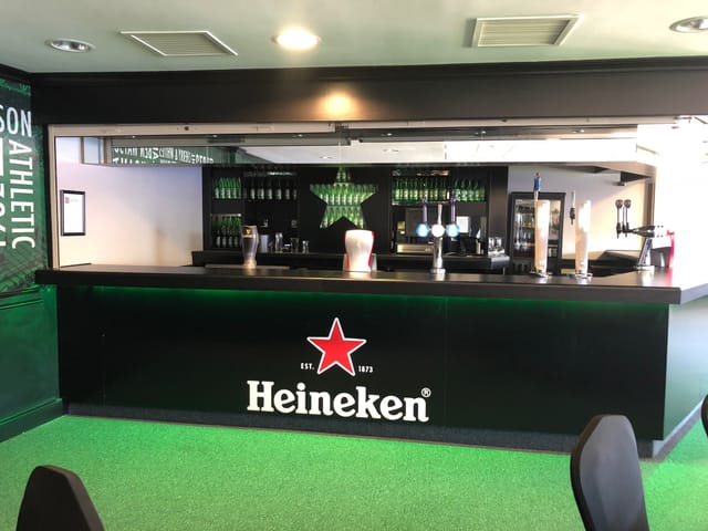 Modern bar at The Carling Lounge, DW Stadium, ideal for events and networking.