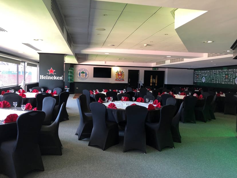Elegant event space at The Carling Lounge with round tables for corporate gatherings.