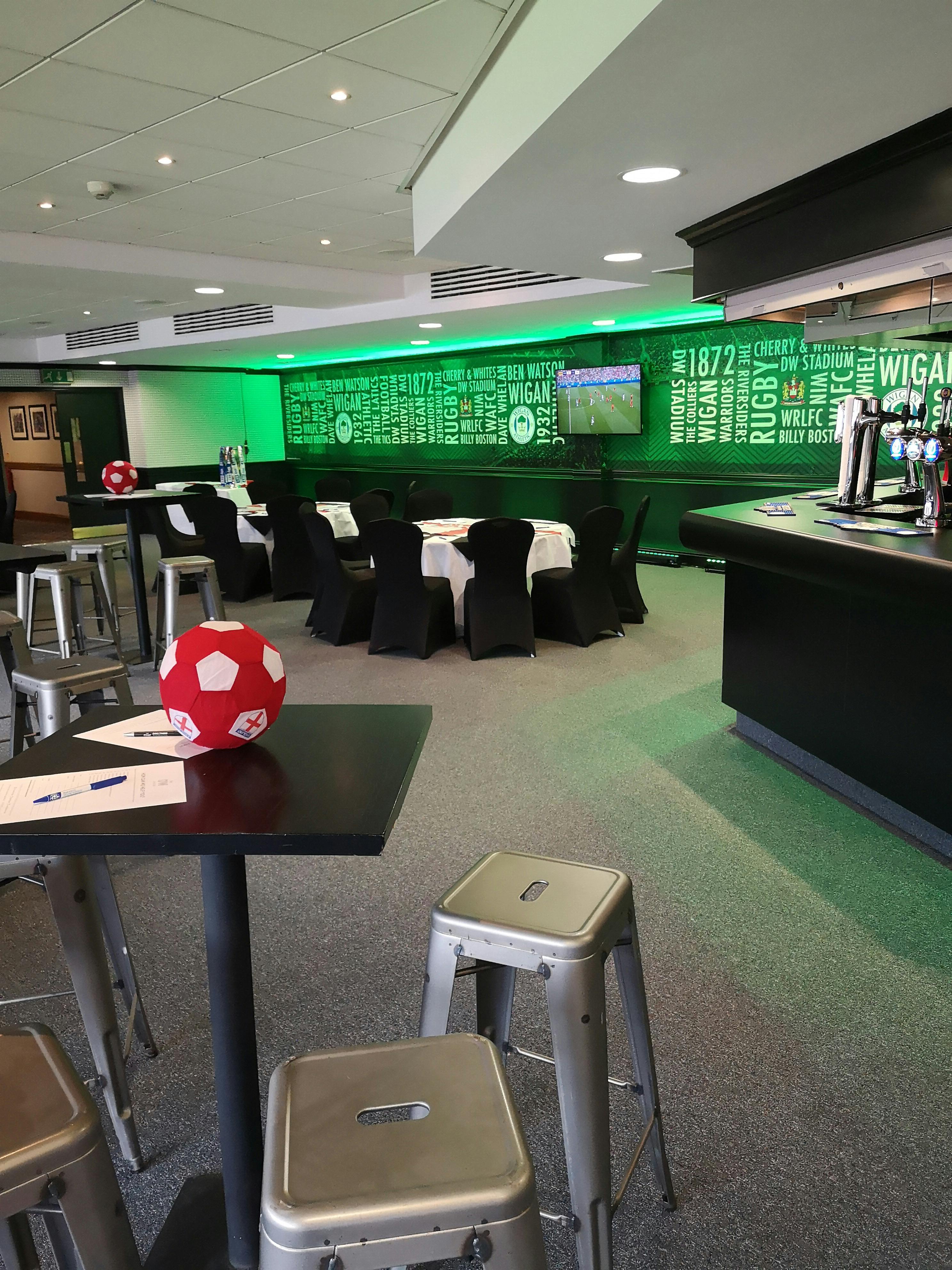 The Carling Lounge at DW Stadium, modern event space for sports and corporate gatherings.