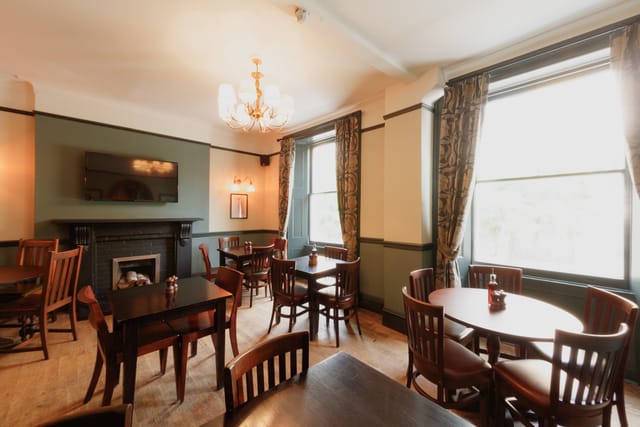 Private dining room at The Perseverance with modular tables for intimate breakout events.