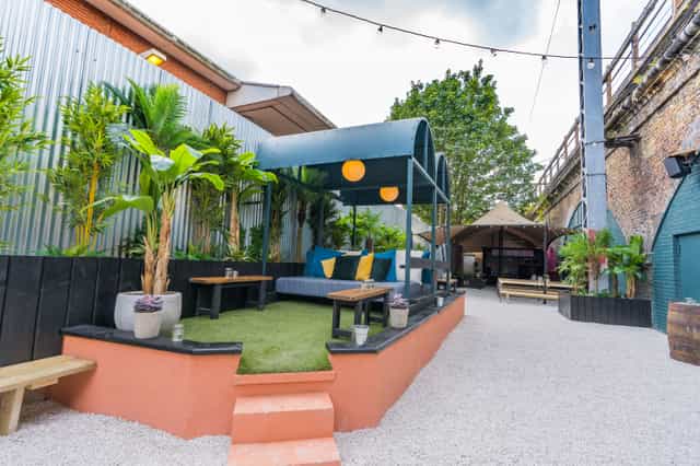 Vibrant outdoor event space with cozy seating for networking and team-building at Night Tales.