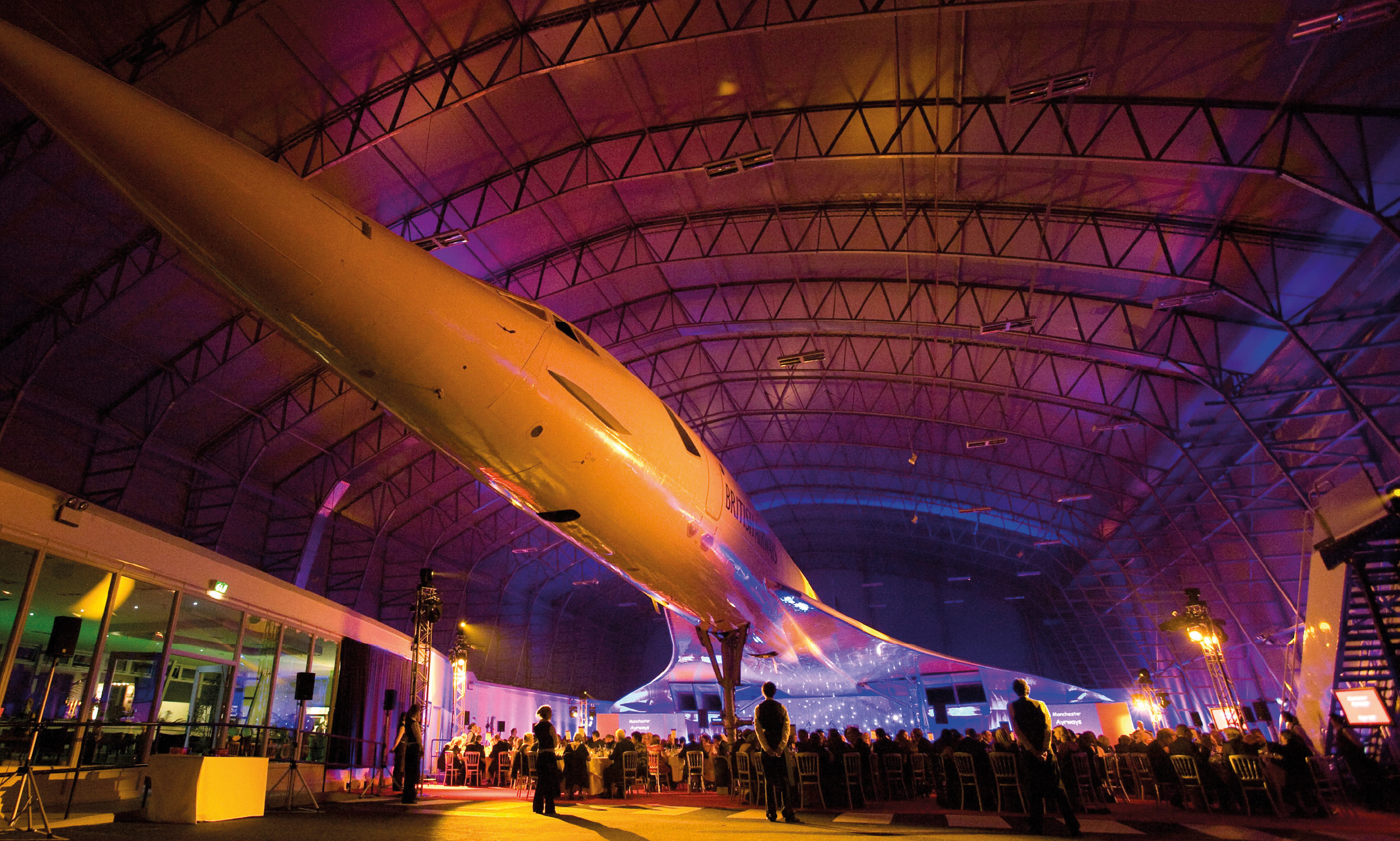 Christmas party at Concorde Conference Centre with illuminated aircraft centerpiece. - Banner