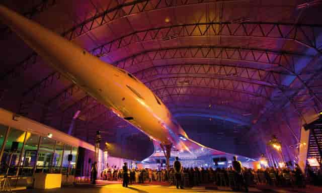 Christmas party at Concorde Conference Centre with illuminated aircraft centerpiece.