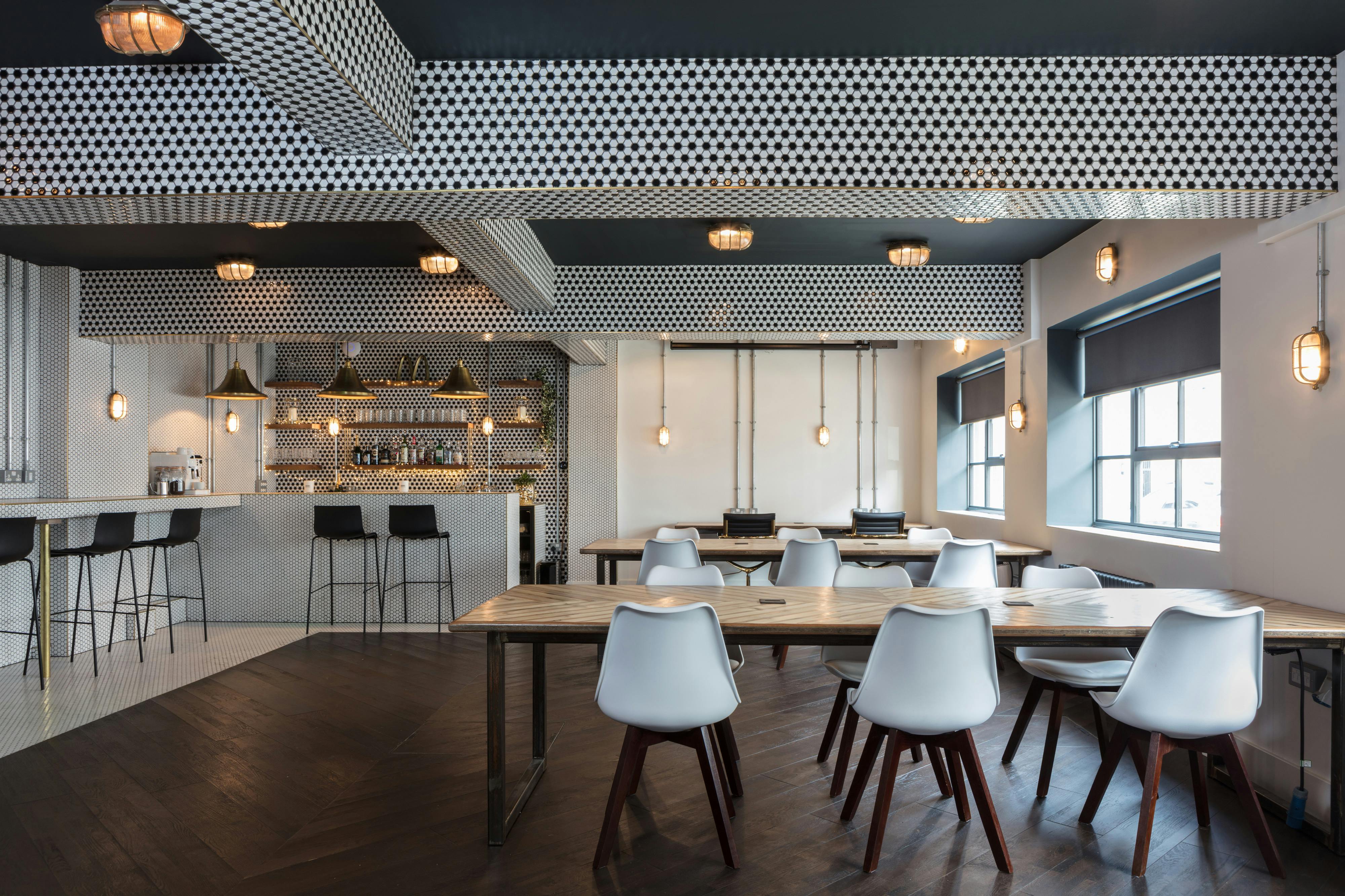 Modern event space at The Vine Club Brighton with sleek bar and ample seating.