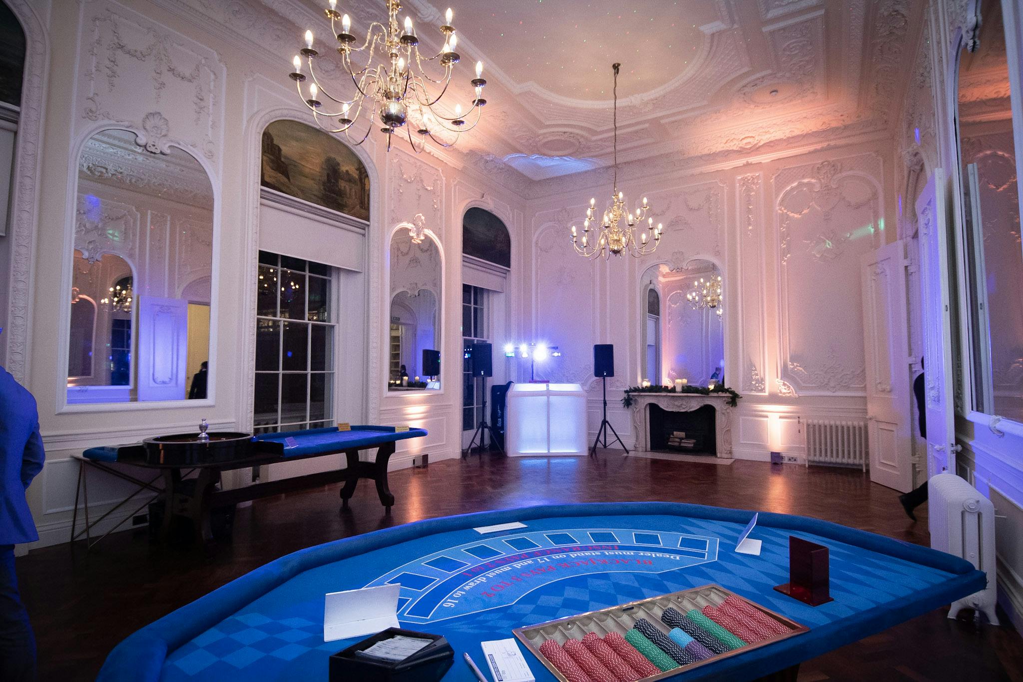 Casino-themed Christmas party at Carlton House Terrace with elegant decor and gaming tables.