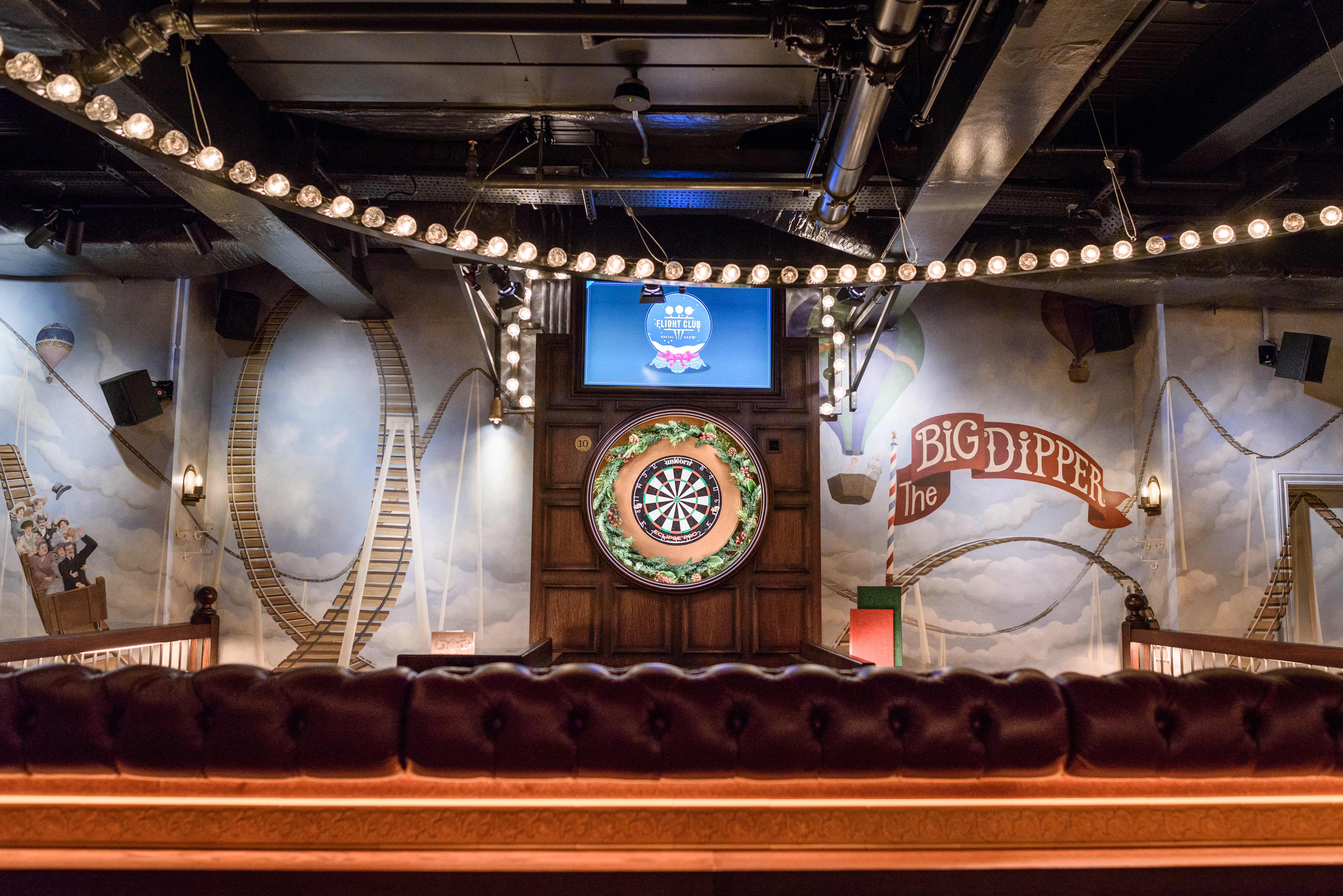 Funfair event space at Flight Club Victoria with dartboard, ideal for networking and team-building.
