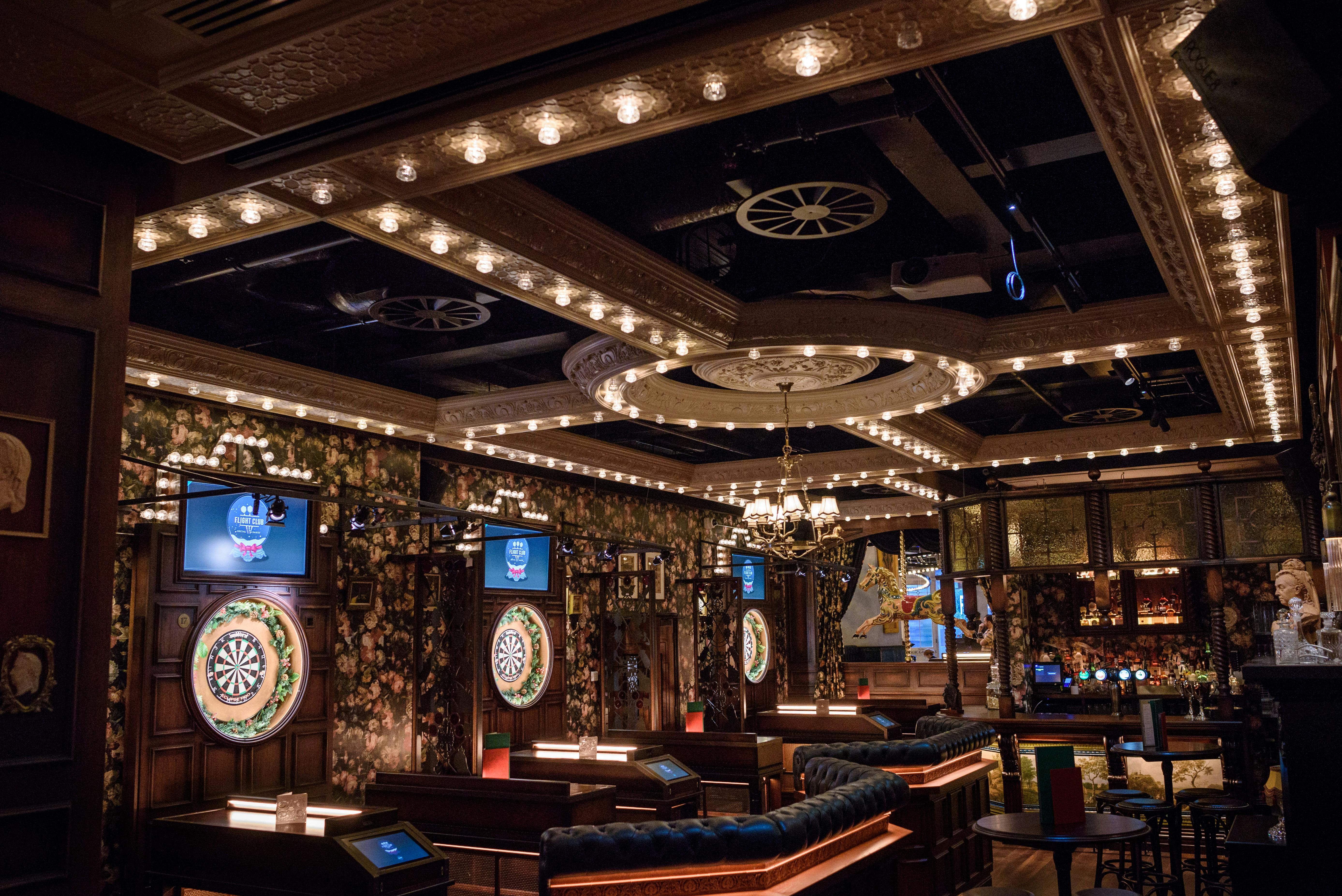 Stylish event space at The Old Vic, featuring dartboards for corporate gatherings.