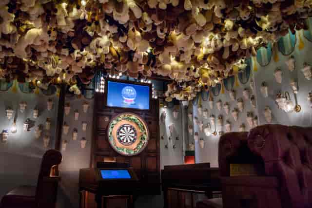 "Whimsical event space with plush toy ceiling for team-building activities at Flight Club Victoria."