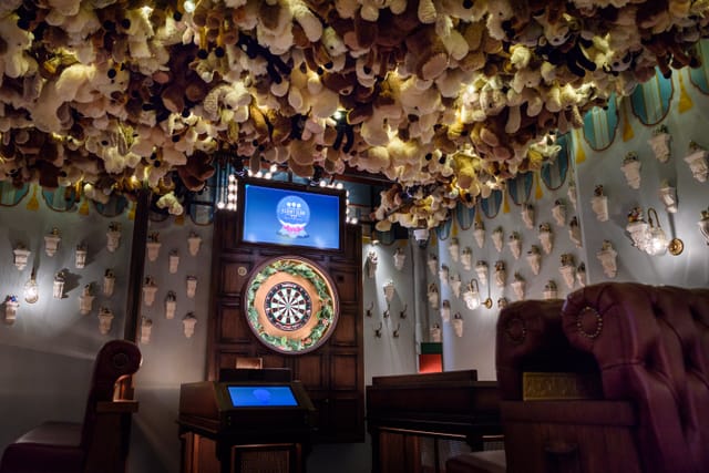 "Whimsical event space with plush toy ceiling for team-building activities at Flight Club Victoria."