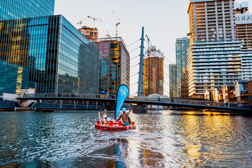 Floating hot tub in urban setting, perfect for unique outdoor events and gatherings.
