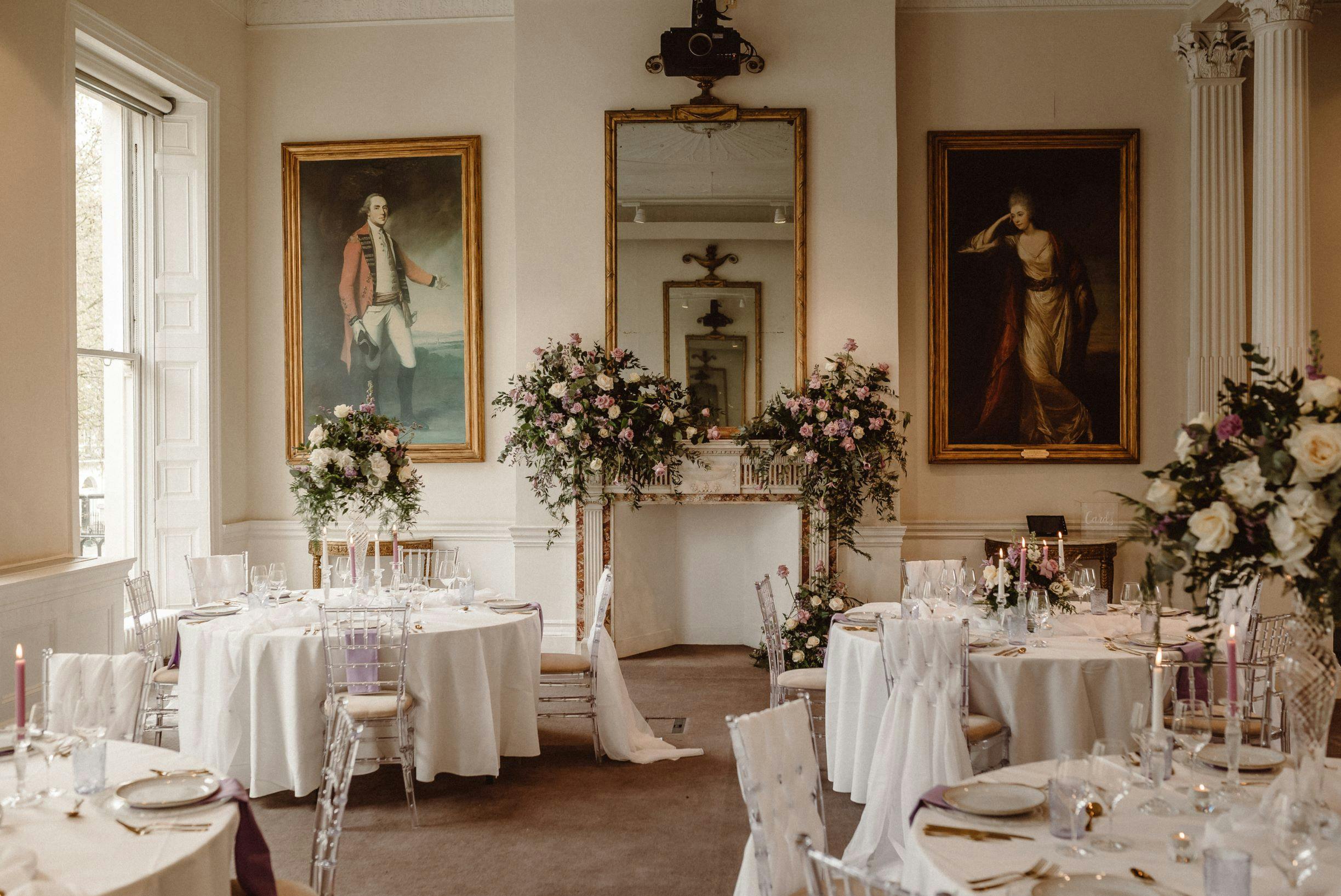 Elegant Christmas event at 41 Portland Place with floral centerpieces and soft lighting.