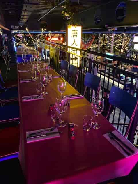 High Line dining setup with colorful lighting for intimate gatherings or corporate events.