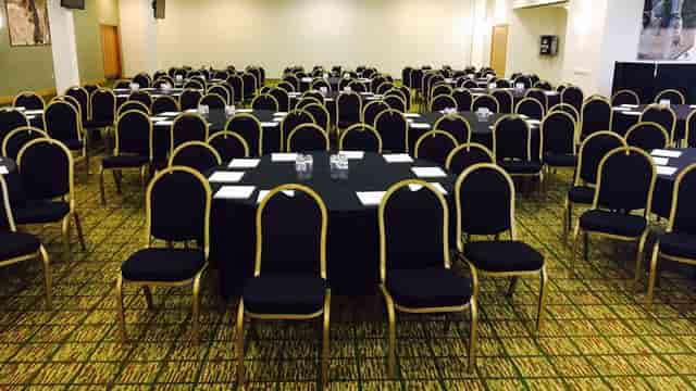 Premiership Suite at Leicester Tigers Stadium, elegant conference space with round tables.