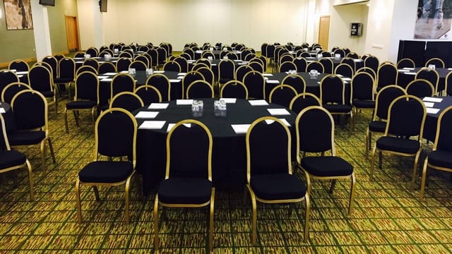 Premiership Suite at Leicester Tigers Stadium, elegant conference space with round tables.