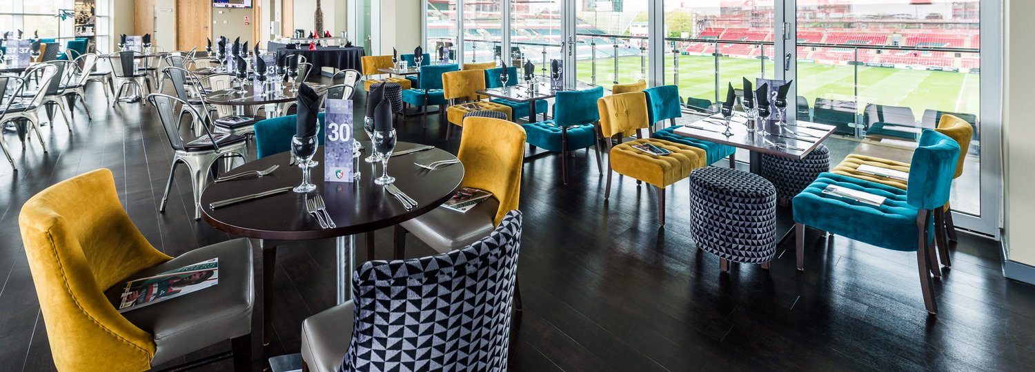Modern Clubhouse Suite at Leicester Tigers Stadium, ideal for upscale meetings and events. - Banner