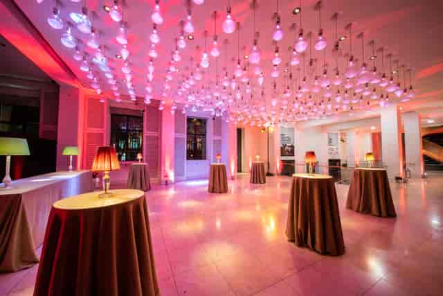 Atrium at Wellcome Collection: elegant event space with colorful lighting for cocktail receptions.