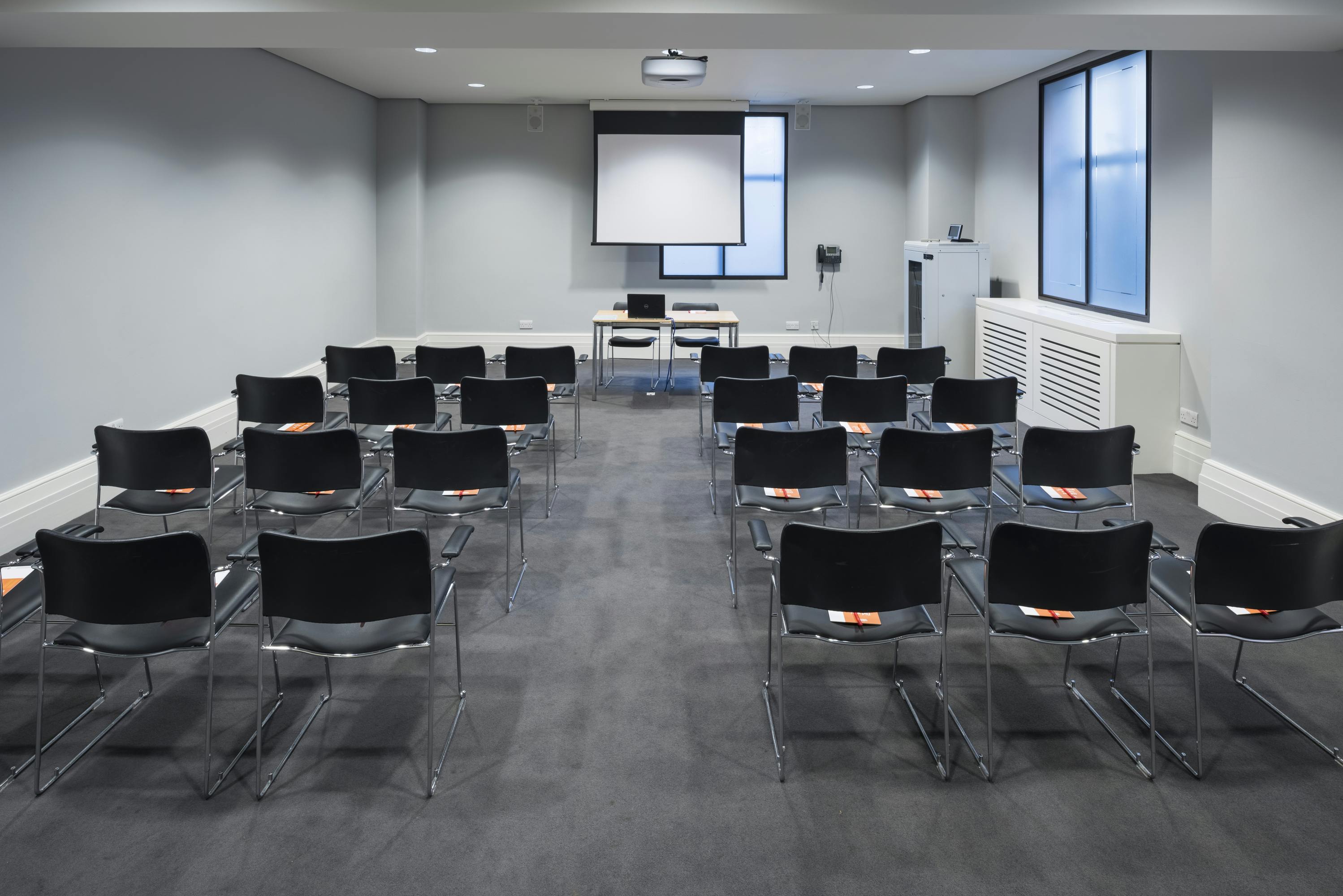 Wellcome Collection meeting room with sleek chairs, ideal for workshops and presentations.