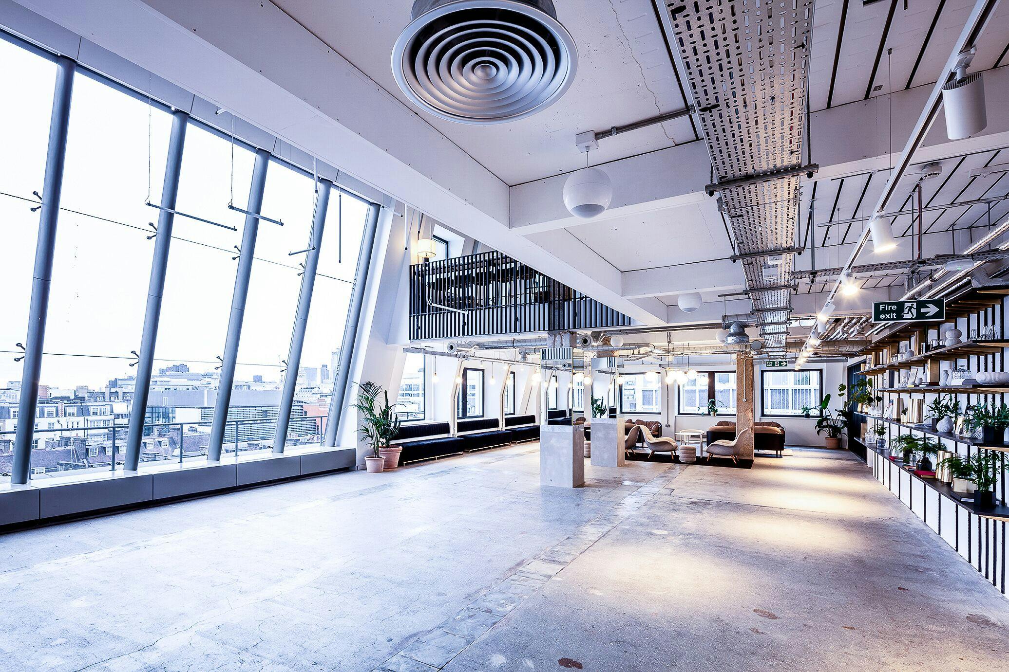 Spacious modern event space with large windows for networking and workshops at LABS House Holborn.