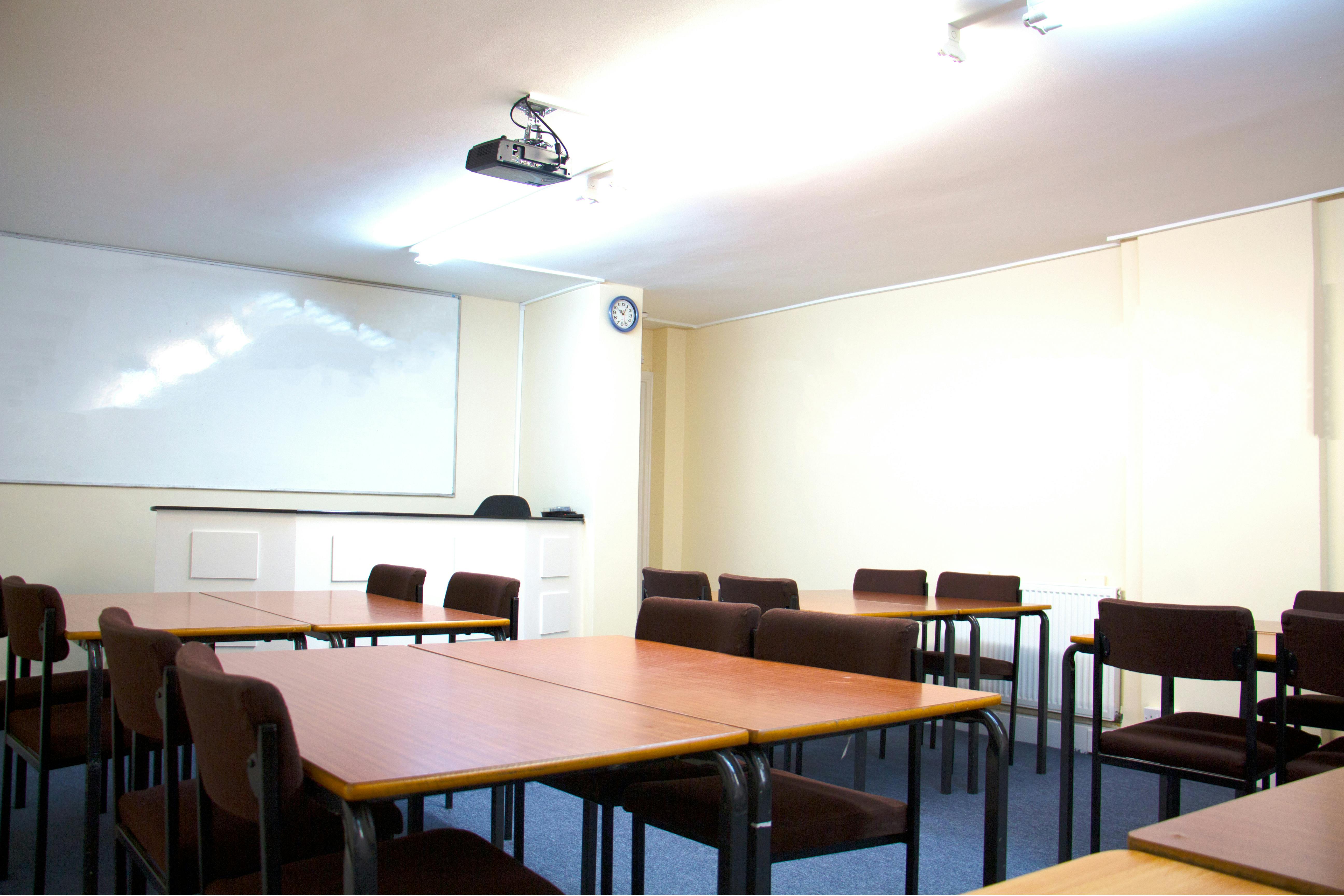 Versatile Meeting Room 106 at North London College, ideal for presentations and collaboration.