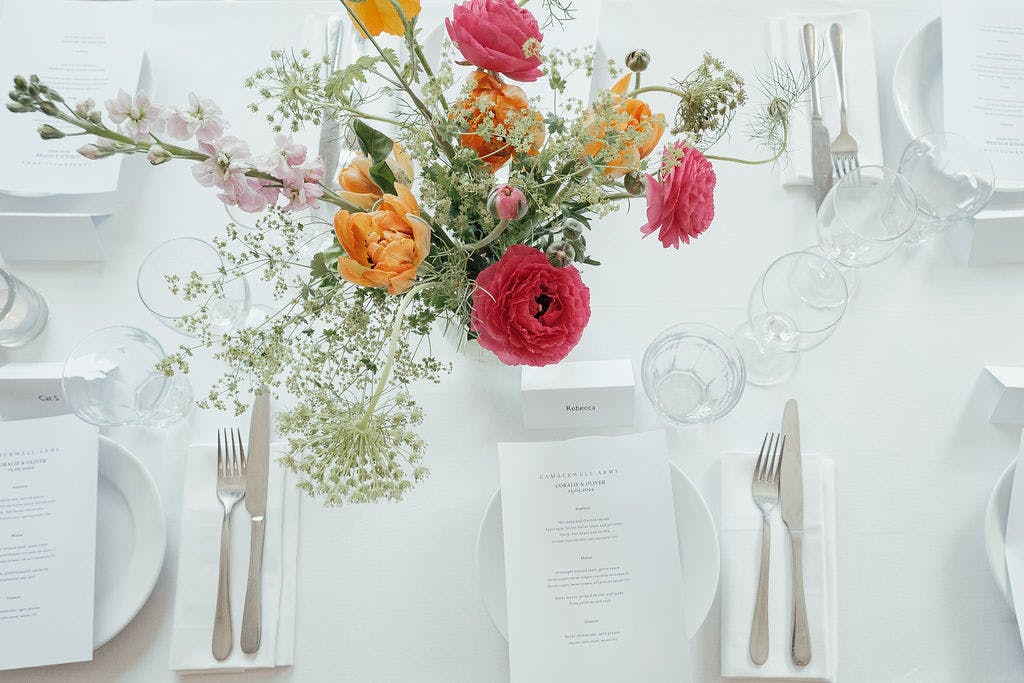 Elegant dining table with floral centerpiece at The Upstairs Room, Camberwell Arms event venue.