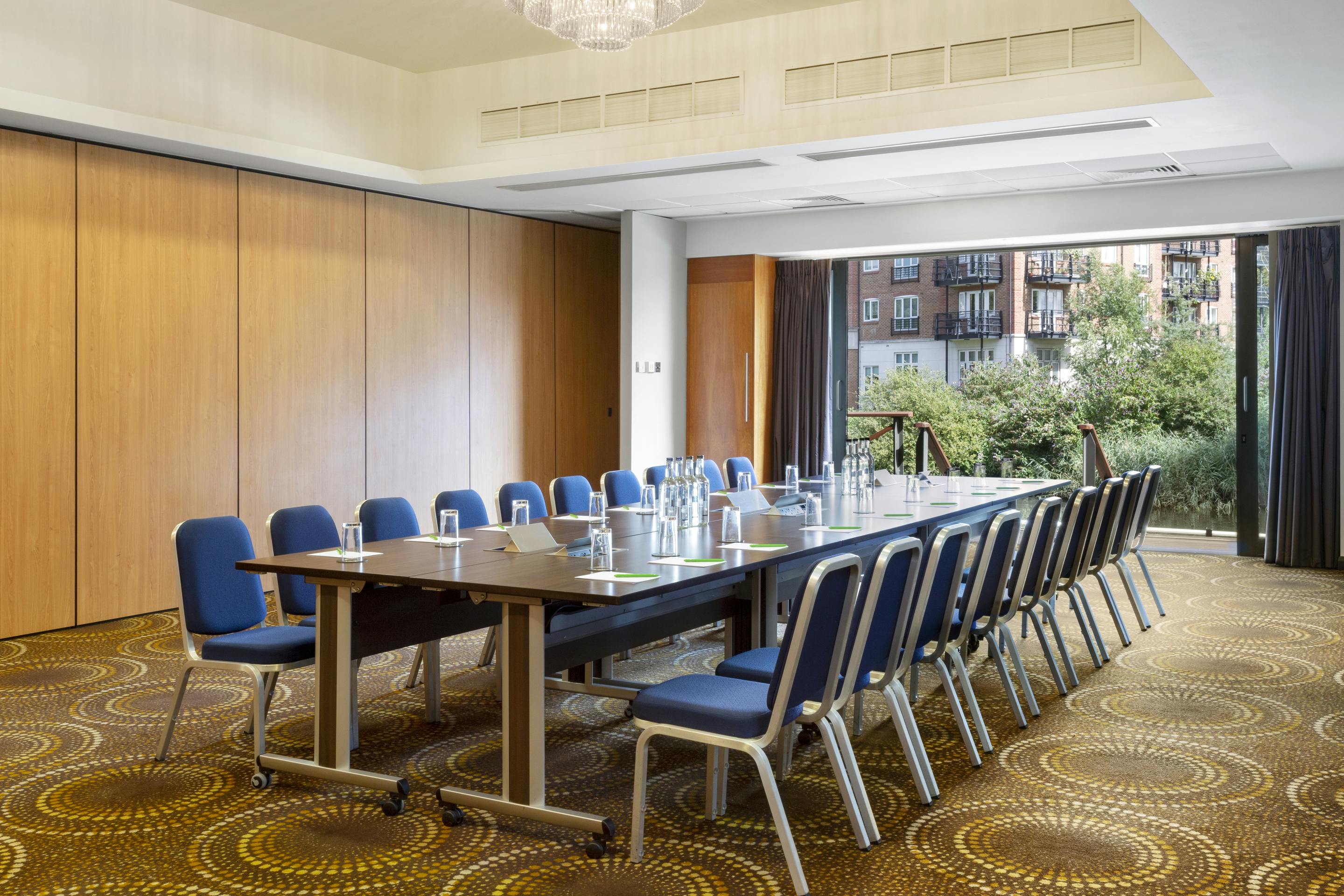 Waterfront Suite meeting room with natural light, ideal for professional events and workshops.