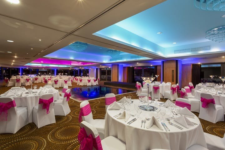 Elegant event space with round tables, ideal for weddings and gatherings at Brentford Lock.