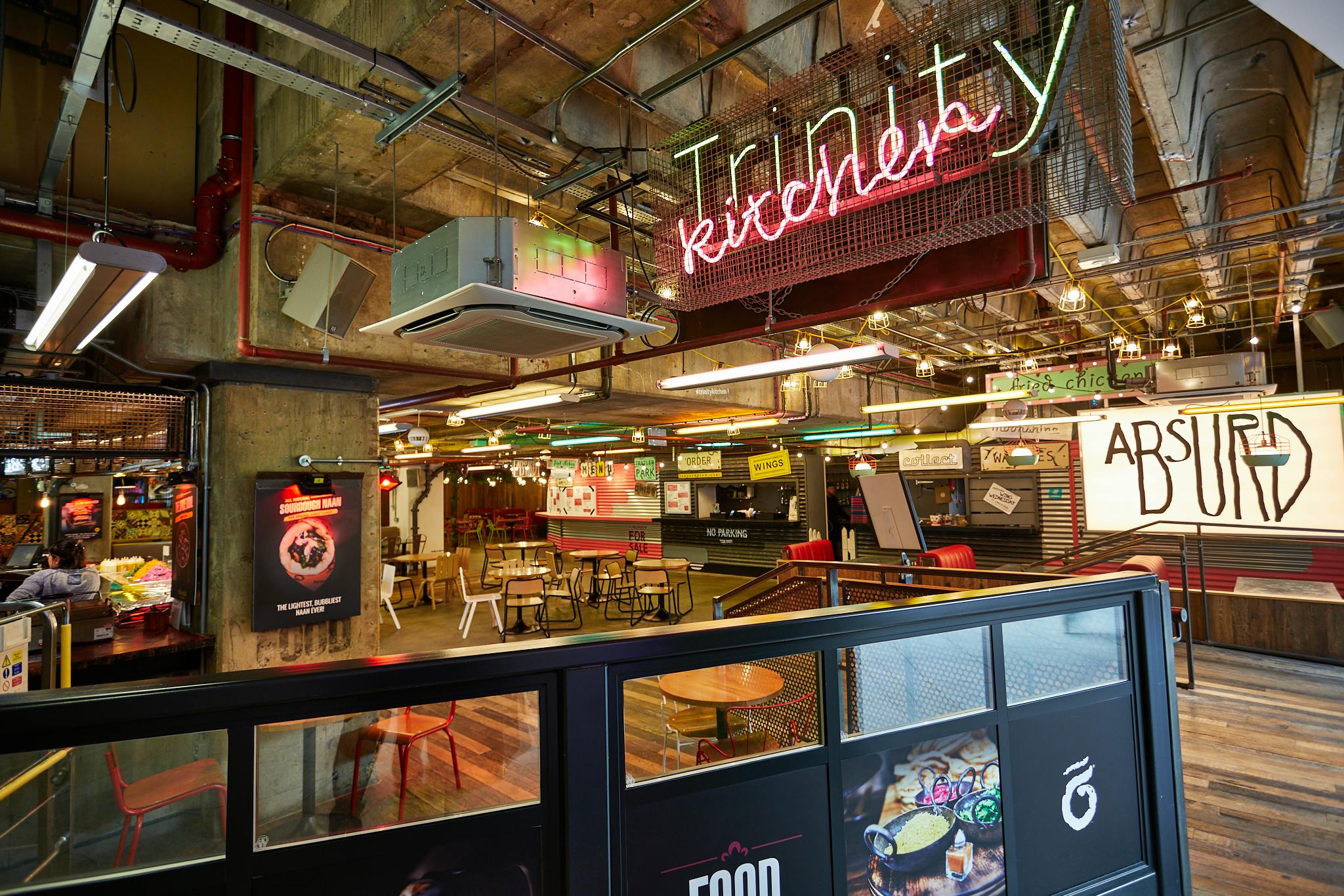 Urban Park food hall with neon decor, ideal for casual networking and team-building events.