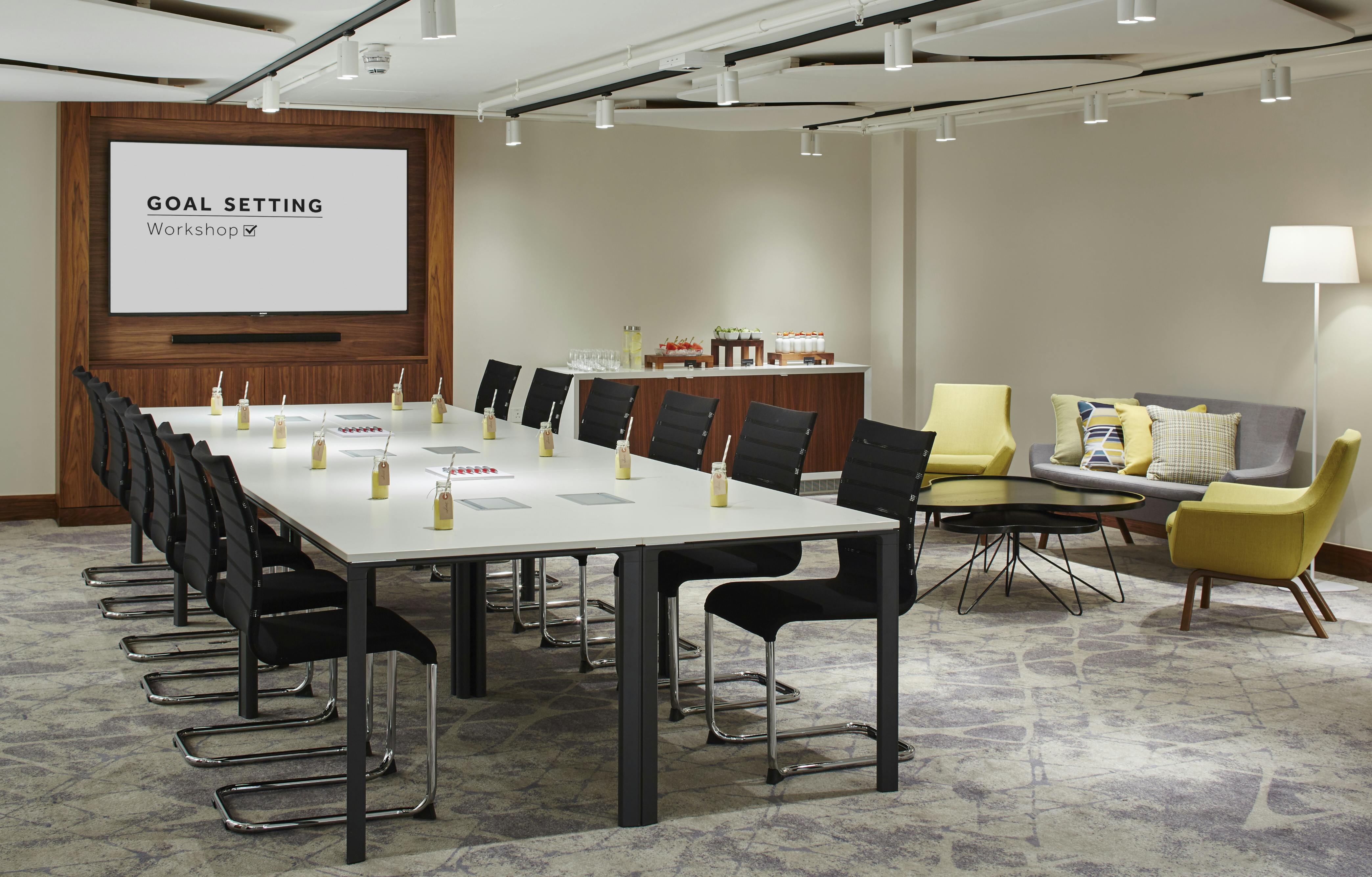 Meeting room at London Heathrow Marriott for a goal-setting workshop with modern seating.