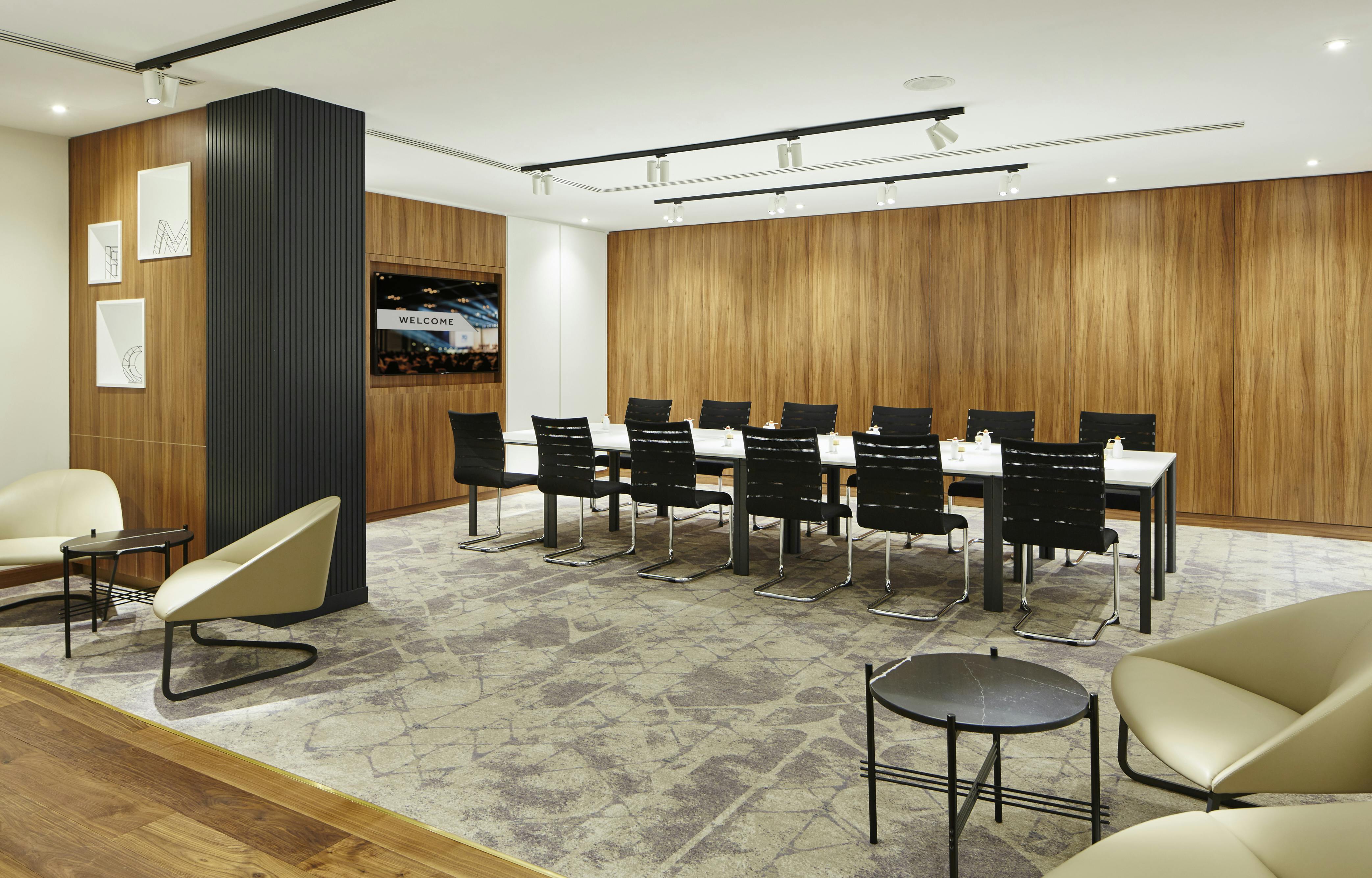 Modern boardroom at London Heathrow Marriott, perfect for meetings and workshops.