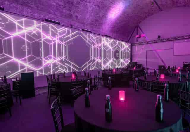 Stylish corporate event space in Aures London with modern projections and elegant decor.