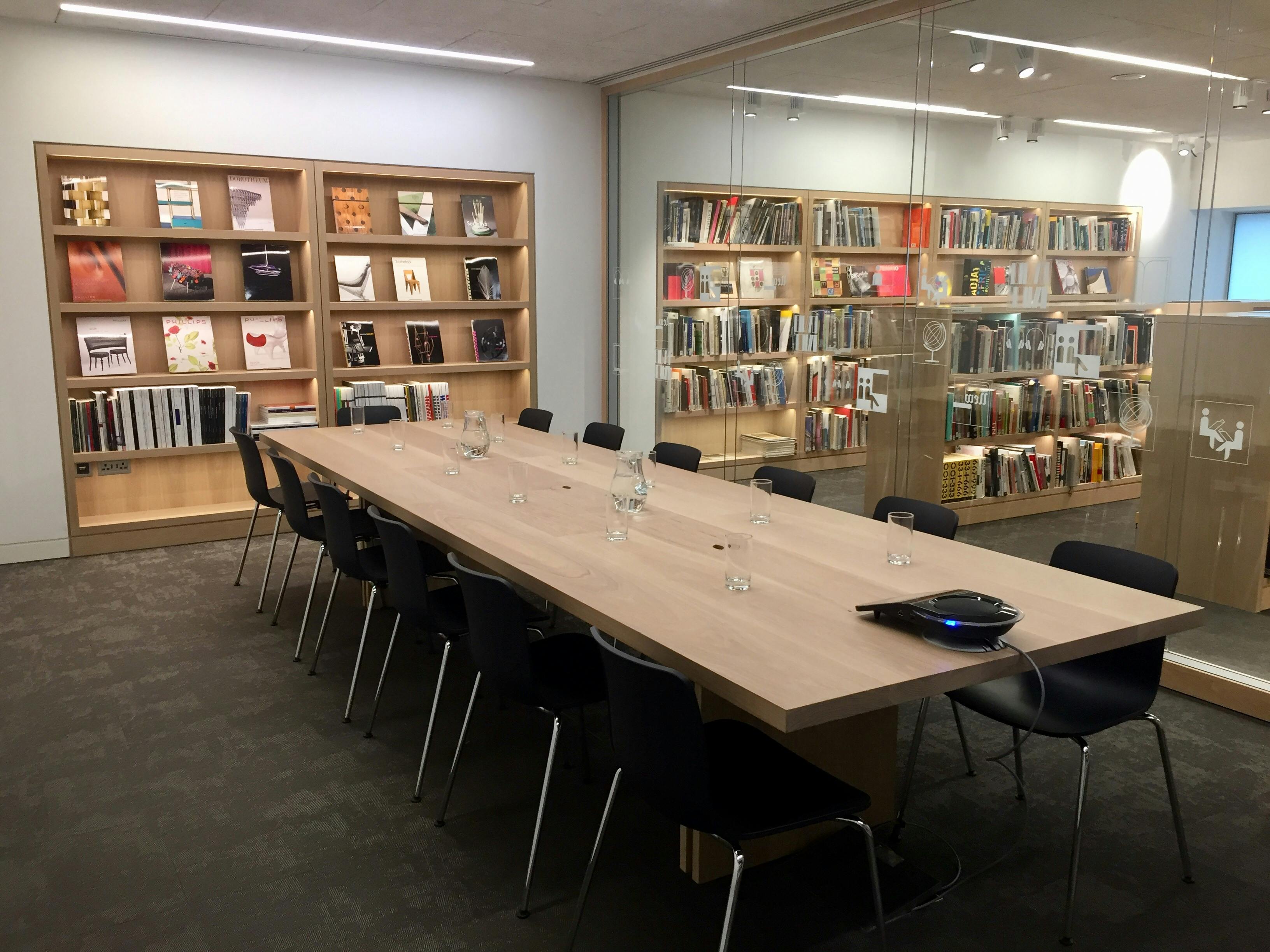 Modern meeting room in Dessau Design Museum with wooden table, ideal for workshops.