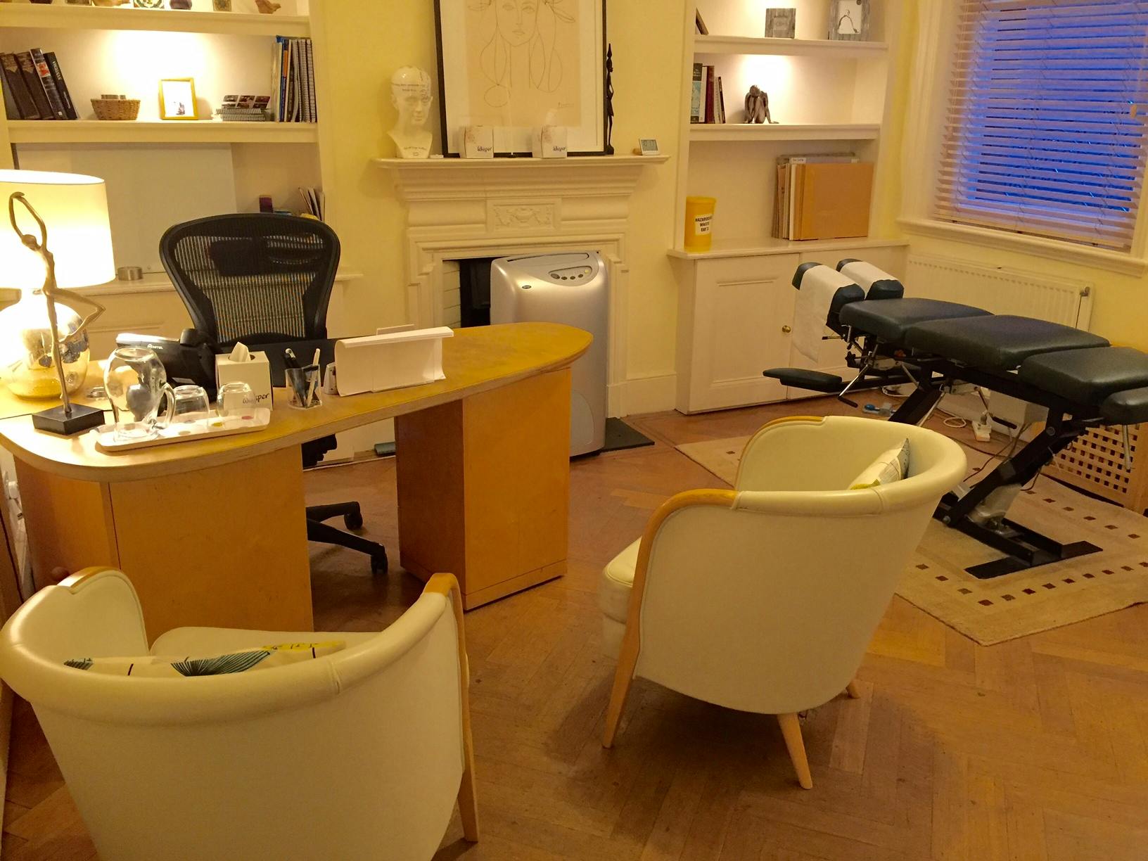 Consulting Room 4 at Wilbraham Place, featuring a treatment table for wellness events.