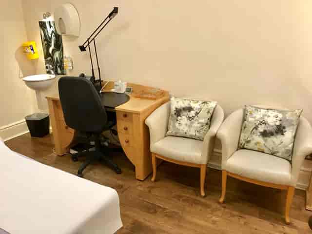 Consulting Room 8 at Wilbraham Place: clean desk, ideal for meetings and planning sessions.