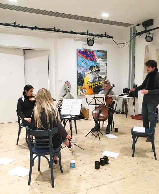 Small ensemble rehearsal in vibrant Streatham Space Project, ideal for intimate events.