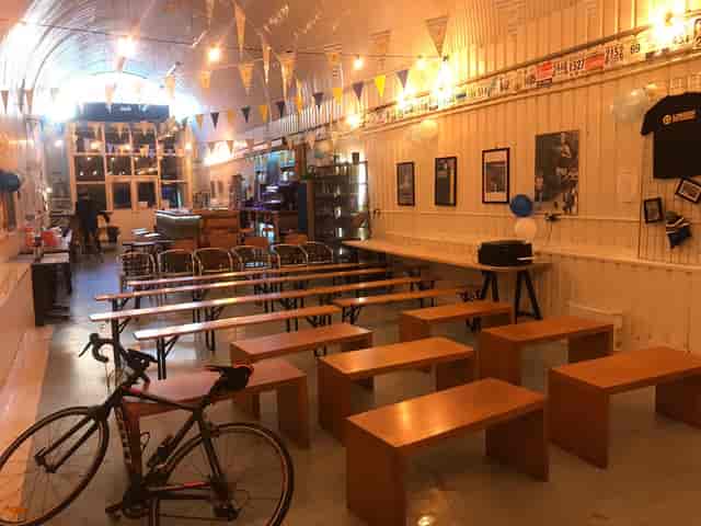 Versatile London event space with wooden benches, ideal for workshops and cycling events.