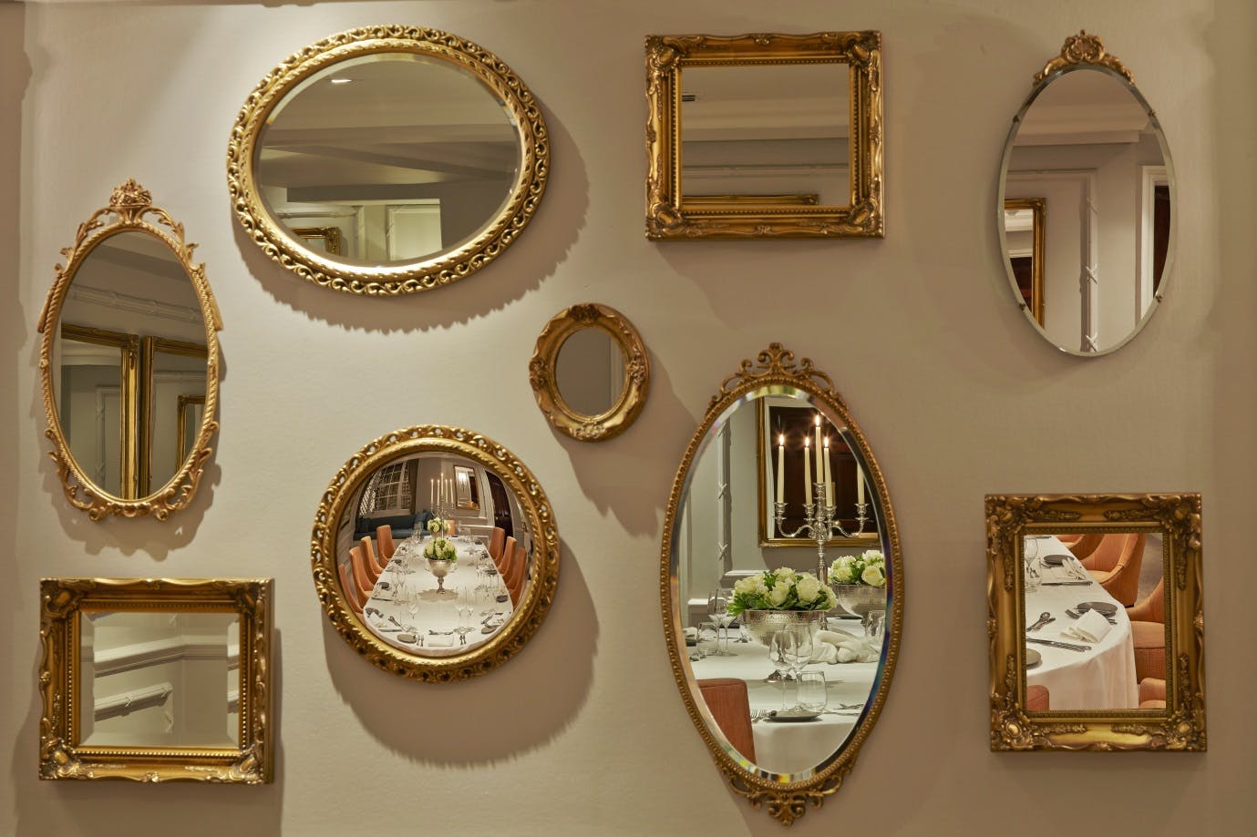 St James Suite at DUKES LONDON with ornate mirrors, perfect for upscale events and celebrations.