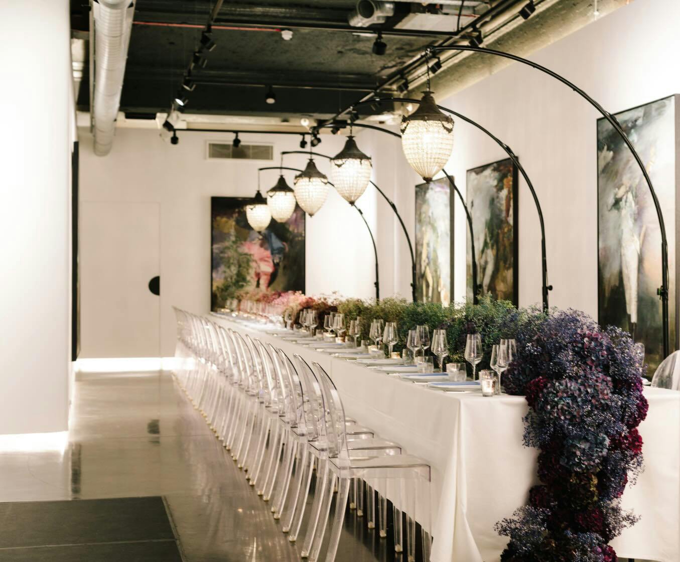 Sophisticated event space with elegant dining table and floral decor at 3 Hanover Square.