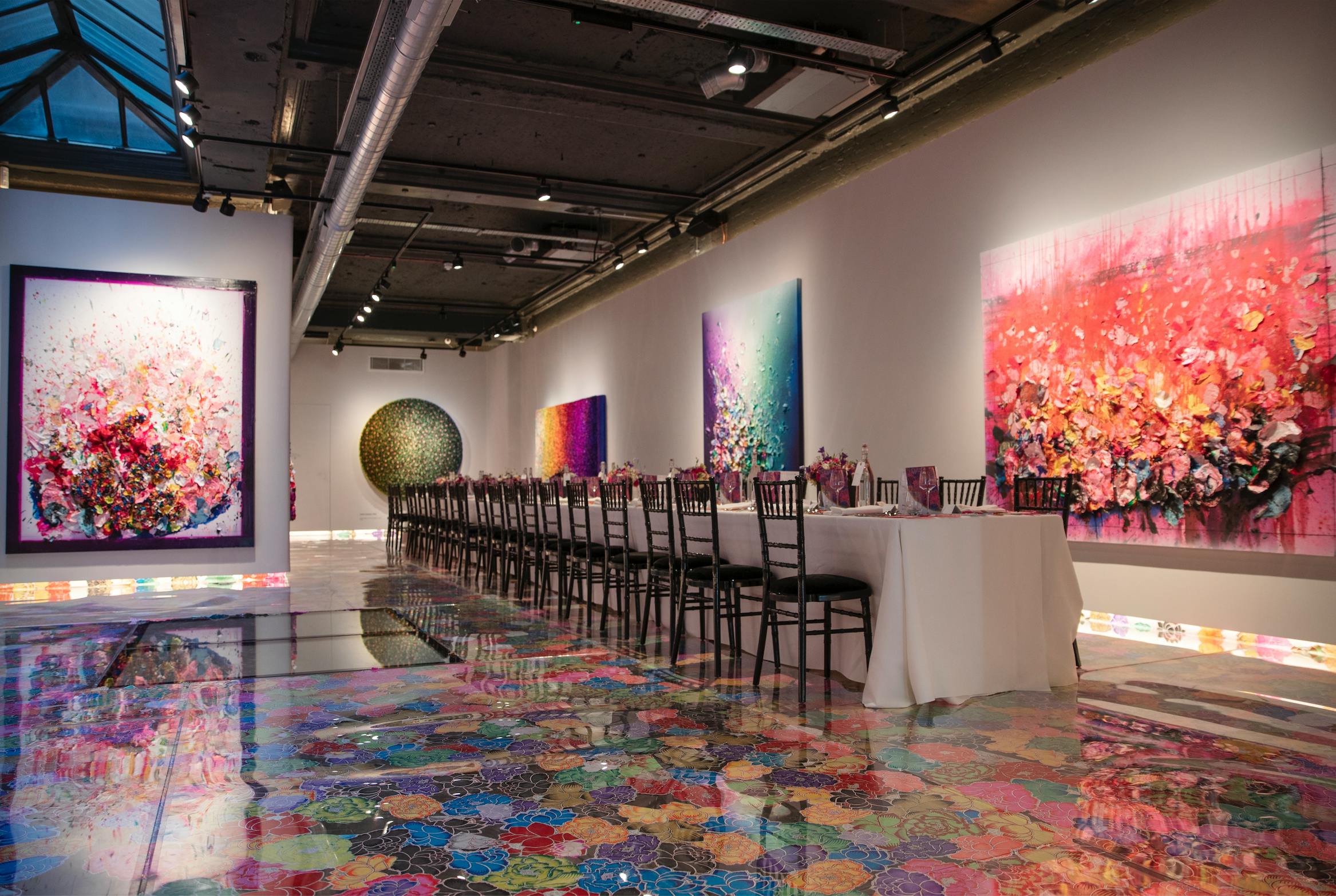 Elegant dining table in vibrant Lower Gallery, ideal for upscale art events and gatherings.