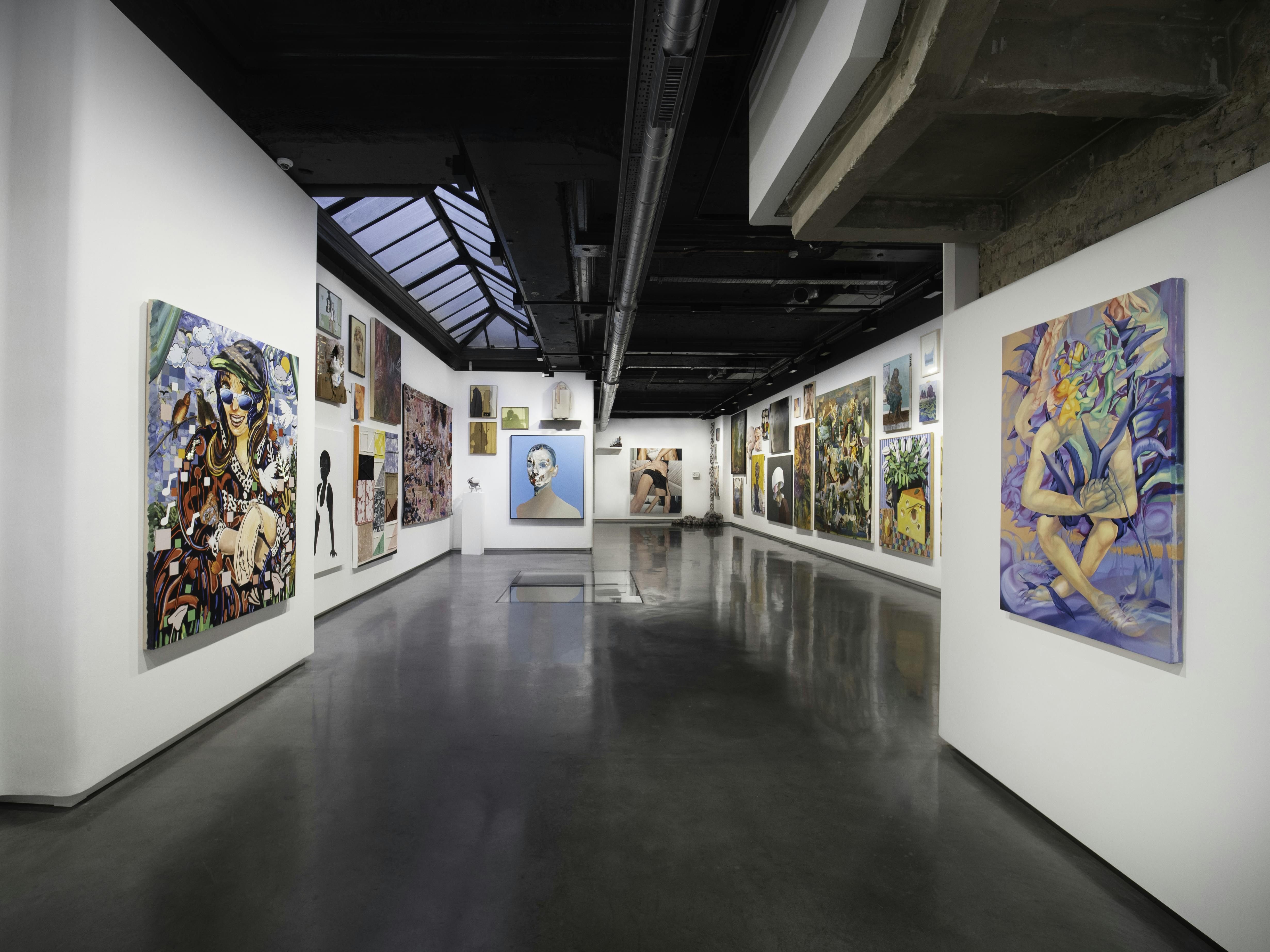 Contemporary art gallery venue with vibrant artworks, ideal for exhibitions and corporate events.