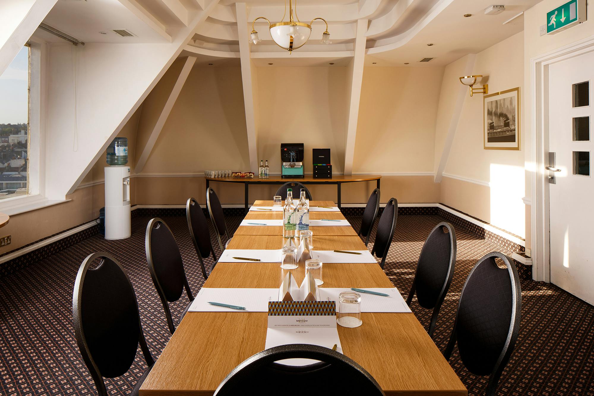 Coast View 2 meeting room at Mercure Brighton, featuring a long table for workshops.