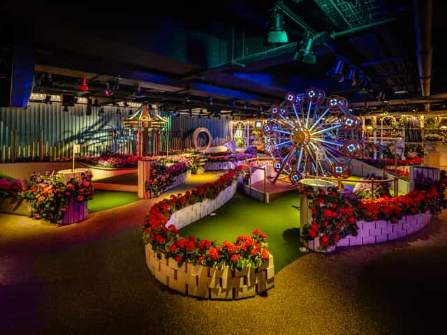 Vibrant East Bandstand Bar with floral decor, perfect for networking events and themed parties.