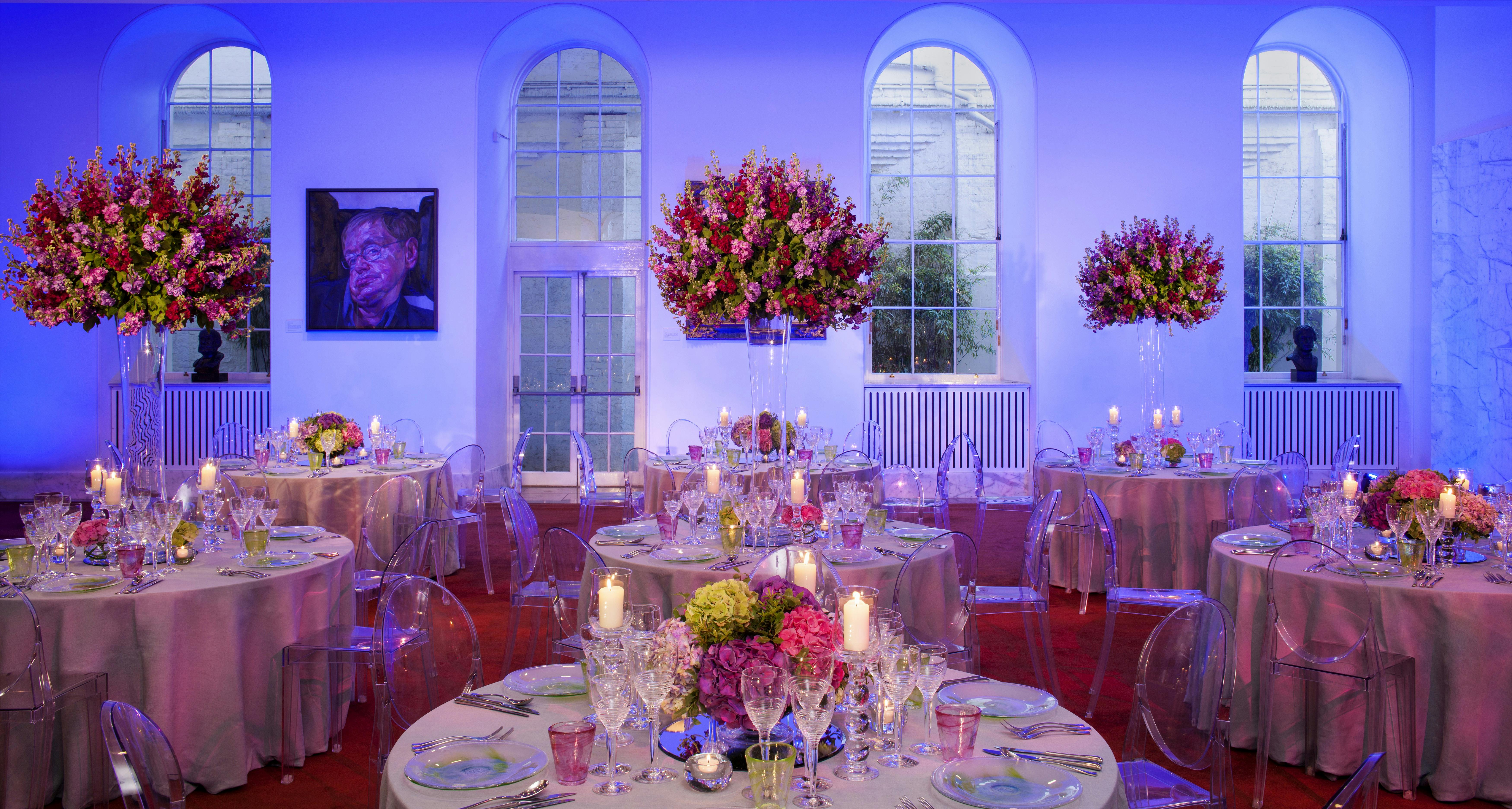 Elegant dining room with floral centerpieces, ideal for upscale events and celebrations.