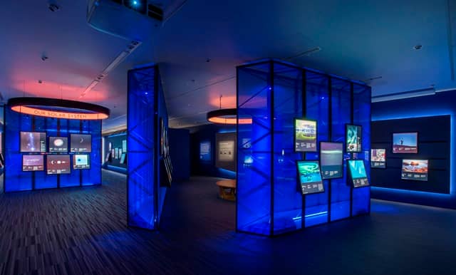 Astronomy Photography Gallery with blue lighting, ideal for networking events and launches.