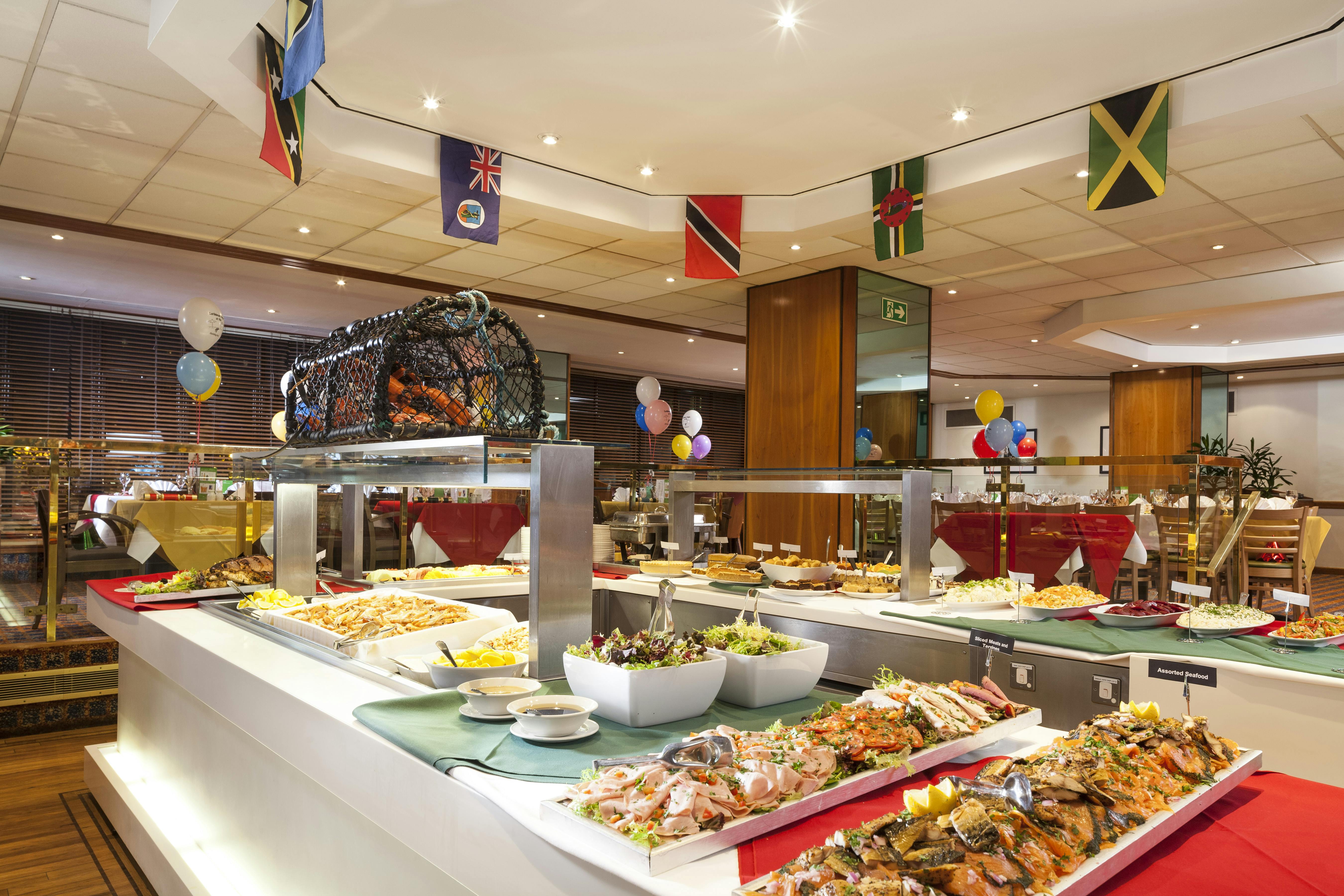 Vibrant buffet setup with colorful dishes at Holiday Inn Kensington for events and gatherings.