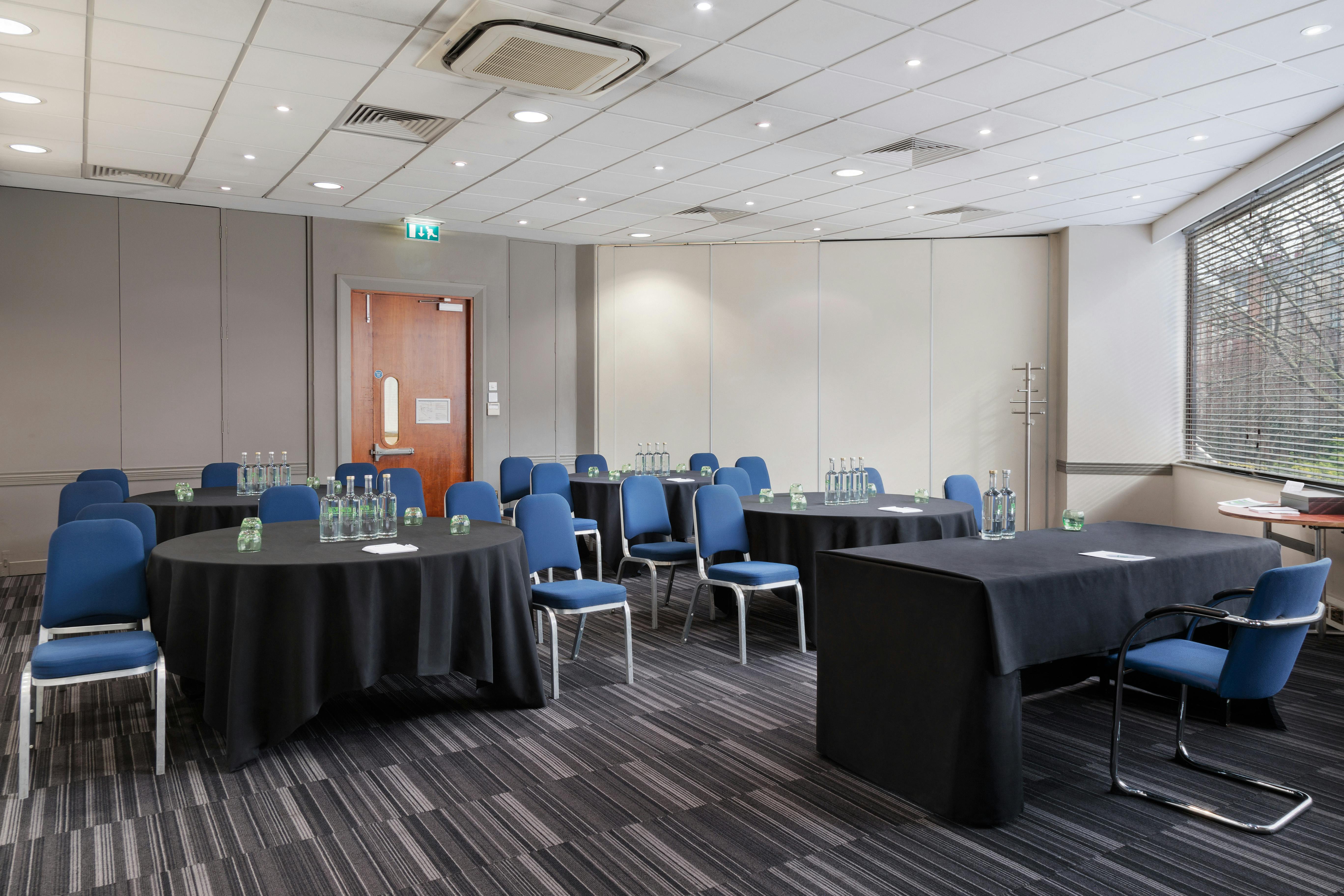 Madonna at a bright meeting room, perfect for workshops and conferences.