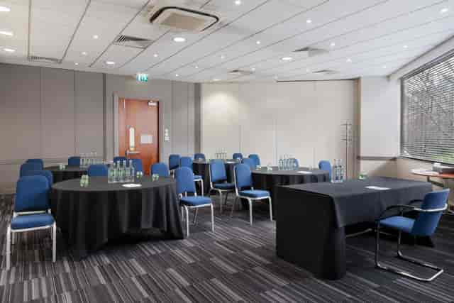 Madonna at a bright meeting room, perfect for workshops and conferences.