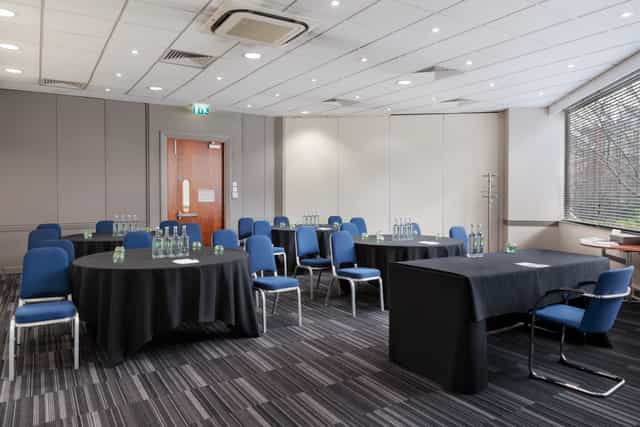 Madonna at a bright meeting room, perfect for workshops and conferences.